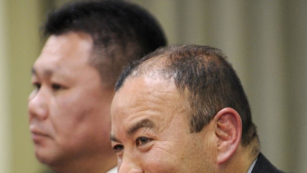 The new head coach of Japan's national rugby team Eddie Jones (R) speaks before press in Tokyo on December 26, 2011, while new assistant coach Masahiro Kunda (L) looks on.