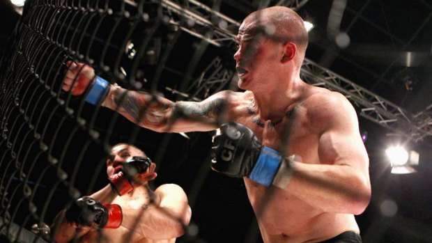 Robert Whittaker (left) sways out of the way of a Corey Nelson punch during their CFC 18 bout in Sydney last year. Whittaker won the bout via submission (second round armbar).