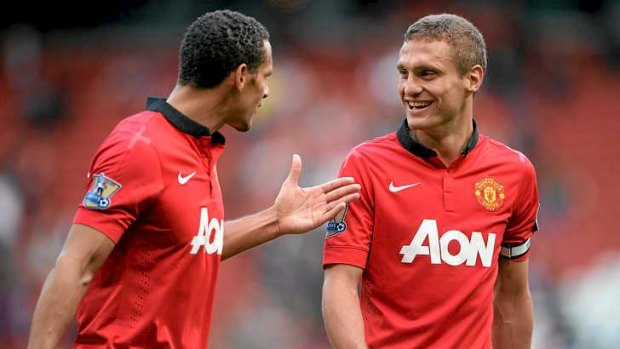 On the way out: Nemanja Vidic (right) and defensive partner Rio Ferdinand, who is expected to retire at season's end.