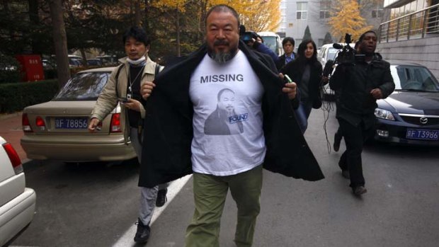 Unhappy ... Ai Weiwei makes his way to the tax office.
