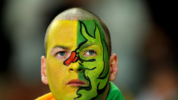 A Wallaby fan has his warpaint on.