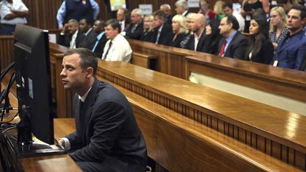 In the dock: Oscar Pistorius sits in the North Gauteng High Court in Pretoria on Monday.