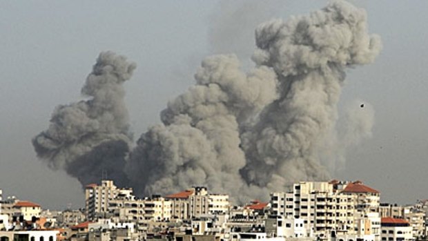 Smoke rises over Gaza following one of yesterday's Israeli air strikes.