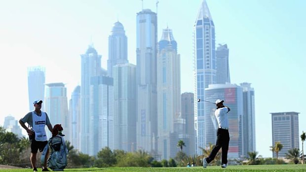 Tiger Woods in action during the Champions Challenge, a preview for the 2014 Dubai Desert Classic.