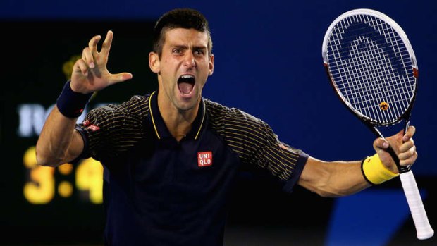 The moment ...  Novak Djokovic celebrates winning championship point.