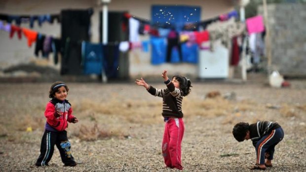 Children play in a refugee camp in Reyhanli near the Turkey-Syria border. International donors have pledged more than $US2.4 billion for the UN aid efforts in Syria.