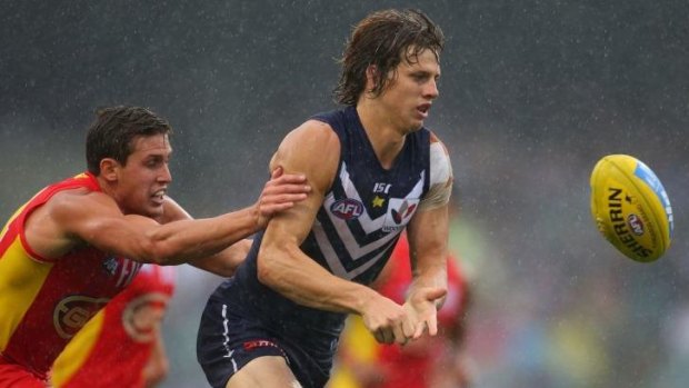 Dockers battled the rain in Perth as they fought off the Gold Coast Suns.