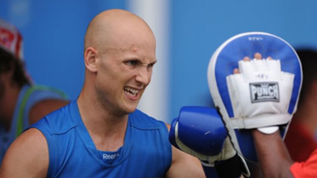Money or the box ... Gary Ablett works out with some boxing training during a session with his new club, the Gold Coast Suns. The former Cats star's lucrative move north is likely to prompt similar defections.