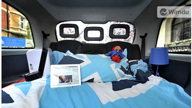 Night rider ... a London cabbie has turned his taxi into a hotel for one, complete with mattress, teddy bear, tables, chairs and even an iPad.