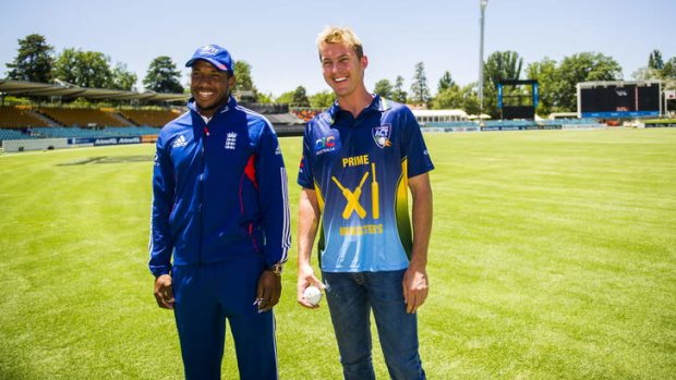 PM's XI skipper Brett Lee has a chat with England's Chris Jordan at Manuka Oval on Monday.