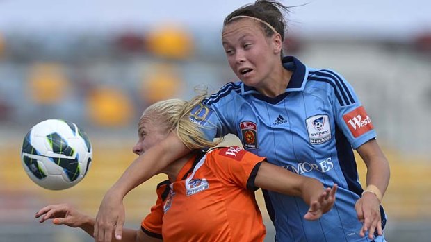 Getting it in the neck ... Caitlin Foord, of Sydney, right, and Tameka Butt, of Brisbane Roar, contest possession during the team’s semi-final in Brisbane.