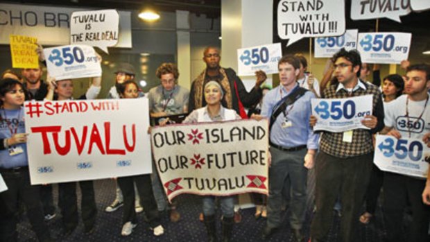 Standing up for Tuvalu ... activists made their point, loud and clear, as delegates arrived at the copnference on Wednesday.