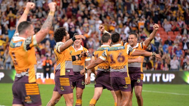 Jubilation: Justin Hodges and the Broncos celebrate Friday night's preliminary final win.