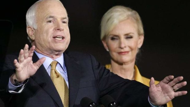Senator John McCain (R-AZ) stands with his wife Cindy.