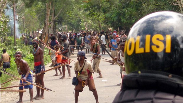 Papuan Dani tribesmen confront Indonesian police in 2006.