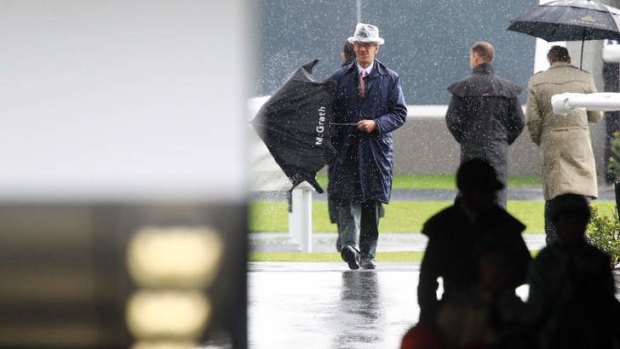 Man in the hat: Chief steward Ray Murrihy at a saturated Randwick on Saturday.