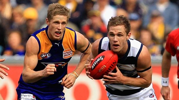 No longer in the shadows: Scott Selwood chases Joel Selwood.