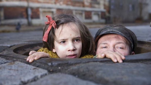 Milla Bankowicz as Krystyna Chiger and Robert Wieckiewicz as Leopold Soha in <i>In Darkness</i>.