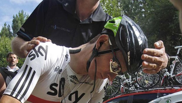 Tour over ... Bradley Wiggins of Britain crashes out with a broken collarbone.
