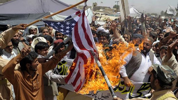 Pakistani Islamists burn a US flag against the killing of Osama bin Laden during a protest in the outskirts of Quetta.