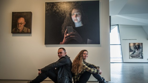 Gordon artist Ross Townsend  with his daughter Hannah, who he painted for the  Doug Moran National Portrait Prize, now showing at the Belconnen Arts Centre.