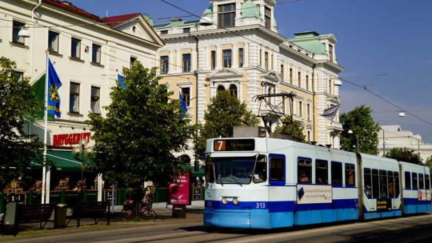 Sweden, Gothenburg, Avenyn, tram travelling on city street.