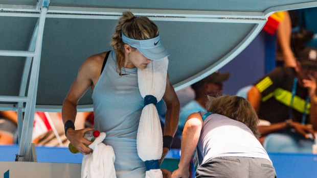 Eugenie Bouchard receives treatment to her left glute.