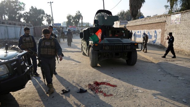 Afghan security police arrive at the scene of a suicide attack in Nangarhar province east of Kabul, Afghanistan.