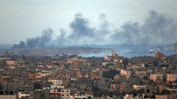 Smoke rises after an Israeli missile strike hit the northern Gaza Strip on Thursday. Ground forces are now on the way.