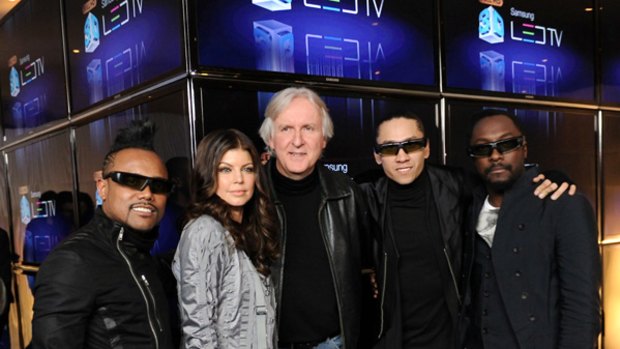 Director James Cameron, center, poses with members of The Black Eyed Peas, from left, apl.de.ap, Stacy "Fergie" Ferguson, Taboo and will.i.am at Samsung's new High-Def 3D LED TV celebration.