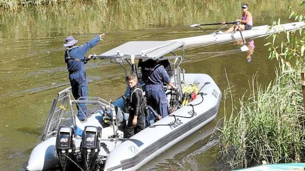 The police search boat on the Yarra on Friday morning.