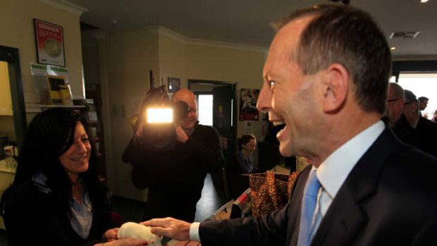 Tax for all, great and small ... Tony Abbott visited the RSPCA to reveal what the carbon tax will cost them.