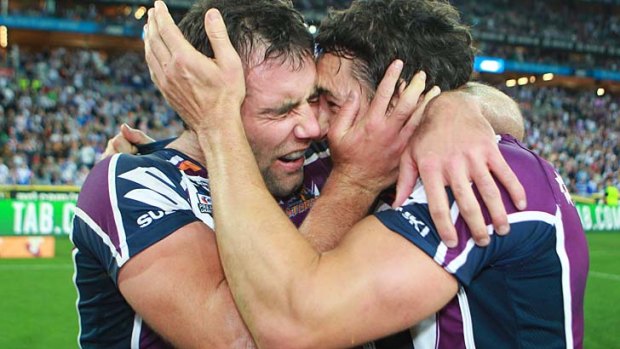 Champions ... Melbourne Storm captain Cameron Smith and Billy Slater celebrate their grand final win.