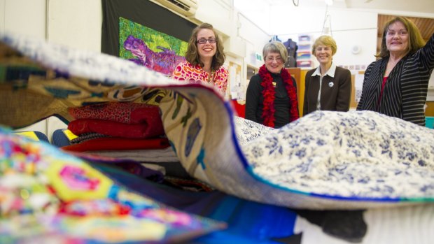 Canberra Quilters member Gemma Jackson, president Helen Rose, Jan Gorgon and Karen Brown with quilts to be shown at the show.