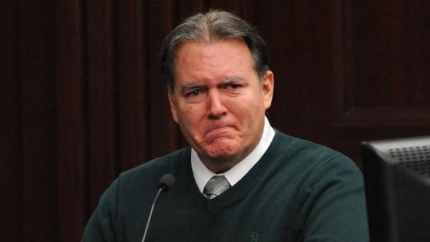 Michael Dunn reacts on the stand during testimony in his own defence in February.