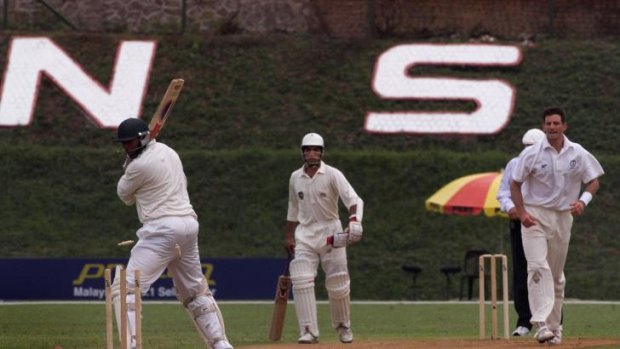 Australia battles Canada in cricket at the 1998 Kuala Lumpur Commonwealth Games.
