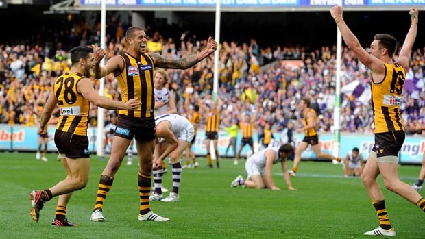 Hawthorn's Paul Puopolo, Lance Franklin and Jack Gunston celebrate on the siren.