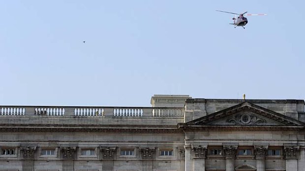 The helicopter leaves Buckingham Palace.