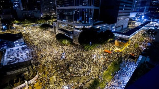 Rally point: Thousands of pro-democracy protesters gather outside Hong Kong's government headquarters, vowing to maintain an increasingly tense civil disobedience campaign. 
