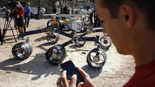 Matt Heverly uses an iPhone app to control the rover.