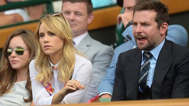 Toothpick for your thoughts?: Actor Bradley Cooper and his girlfriend British model Suki Waterhouse in the royal box at the men's final in Wimbledon.