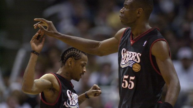 Odd couple: Dikembe Mutombo with Allen Iverson during their stint at Philadelphia.
