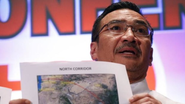 Malaysia's acting Transport Minister Hishammuddin Hussein shows a map with the northern corridor where Malaysia Airlines Flight MH370 may have reached.