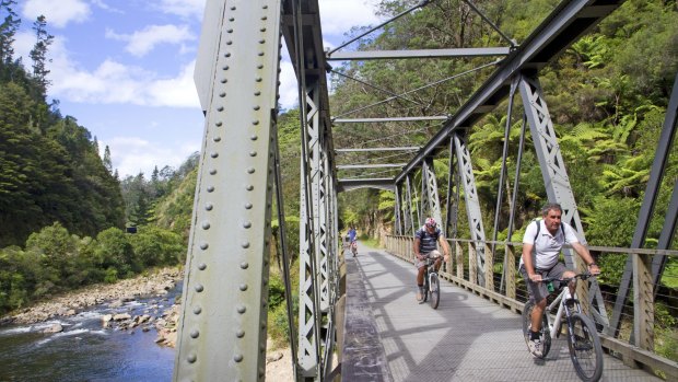 Spectacular: Cyclists cross a bridge in Karangahake Gorge.