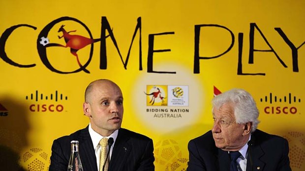 Mark Arbib (L) speaks next to Football Federation Australian Chairman Frank Lowy last year, ahead of Australia's 2022 World Cup bid.
