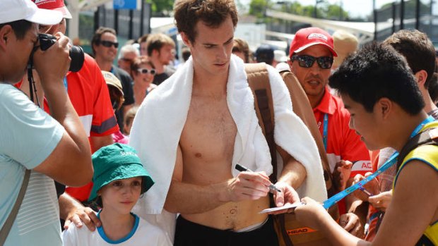 Slam happy: Andy Murray signs autographs in Brisbane where he is preparing for the Australian Open.
