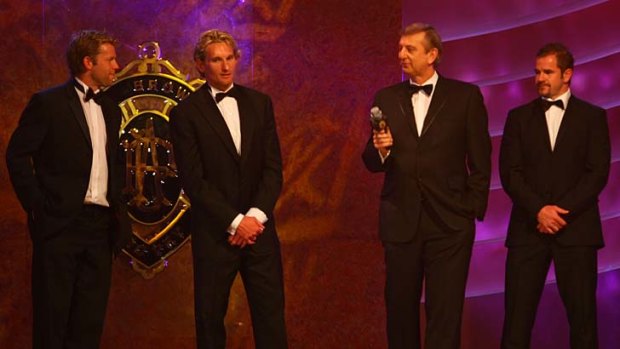 Pillars of the competition. James Hird, second from left, and Mark Ricciuto, far right, at the 2007 Brownlow Medal presentation.