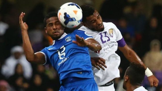 Saudi's al-Hilal forward Nasser Al-Shamrani vies for the ball with UAE's al-Ain defender Mohamed Ahmed during their AFC Champions League semi-final.