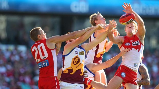Luke Parker goes for a mark when the Lions and Swans clashed in season 2013.