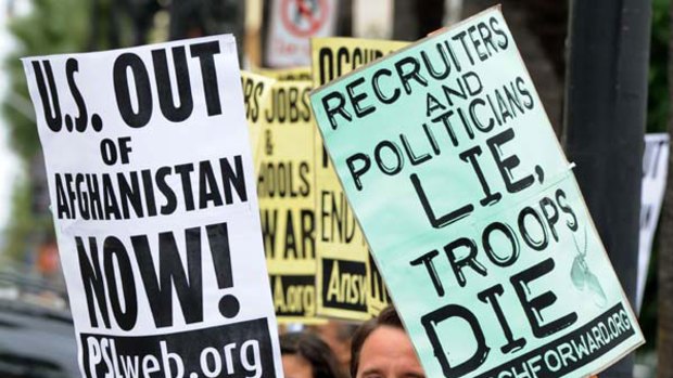 Tenth year ... anti-war protesters outside a US armed forces recruiting station in Los Angeles on Wednesday, the ninth anniversary of the start of the Afghan war.
